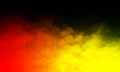 Abstract red and yellow smoke mist fog on a black background. Royalty Free Stock Photo