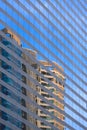 Abstract reflection pattern of skyscraper on blue glass wall surface of high office building wall Royalty Free Stock Photo