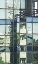 Abstract reflection of sky and city buidings on glass walls of another city building, Kolkata, West Bengal, India