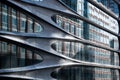 Abstract reflections and curved metal cladding on a modern building