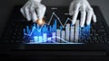 Abstract representation of financial data analysis with robotic hands typing on laptop, showcasing graphs and statistics Royalty Free Stock Photo