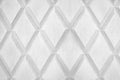 Abstract rhombus shape white and black color background close up, gray concrete wall with diamond texture pattern, copy space