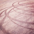 Abstract road background with tire tracks on the asphalt - vintage effect.