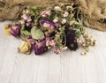 Abstract rose bouquet, Bouquet of dried flowers on old burlap texture Royalty Free Stock Photo