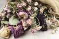 Abstract rose bouquet, Bouquet of dried flowers on old burlap texture Royalty Free Stock Photo