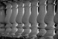 Abstract row of white architectural columns made of stone close-up Royalty Free Stock Photo