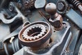 Abstract rusty mechanism. Machine parts. Levers and springs. Nuts and bolts. Metal structure outdoors in the rays of the