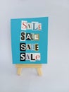 Abstract sale sign on a wood easel on a white background Royalty Free Stock Photo