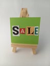 Abstract sale sign on a wood easel on a white background Royalty Free Stock Photo