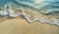 abstract sand beach from above with light blue transparent water wave and sun lights Royalty Free Stock Photo