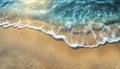 abstract sand beach from above with light blue transparent water wave and sun lights Royalty Free Stock Photo