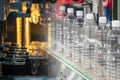 The abstract scene of tube preform shape of bottles preheat process and the plastic bottle in the conveyor belt.