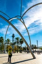 Abstract sculpture Onades and Port Vell Aerial Tramway in Barcelona Royalty Free Stock Photo