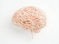 Abstract sculpture of tangled brain like structure on white background symbolizing neural complexity cognitive processes