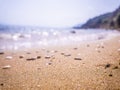 Abstract sea background. Abstract sandy summer beach background with bokeh lights on light blue sky. Beautiful texture. Space Royalty Free Stock Photo