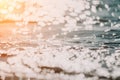 Abstract sea summer ocean sunset nature background. Small waves on golden water surface in motion blur with golden bokeh Royalty Free Stock Photo