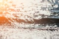 Abstract sea summer ocean sunset nature background. Small waves on golden water surface in motion blur with golden bokeh Royalty Free Stock Photo