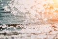 Abstract sea summer ocean sunset nature background. Small waves on golden water surface in motion blur with golden bokeh Royalty Free Stock Photo