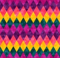 Abstract seamless harlequin pattern from rows of rhombuses in green, yellow, pink and purple