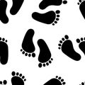 Abstract seamless pattern with black traces of human feet. Footprint isolated on white background. Vector Royalty Free Stock Photo