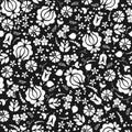 Abstract seamless pattern of black and white flowers , sprigs .