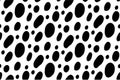 Abstract seamless pattern of Dalmatian spots, black ovals on a white background