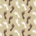 Abstract seamless pattern with footprints on a sand background