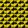 Abstract seamless Row of glowing radioactive yellow black signs on black background.