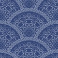 Abstract seamless wavy pattern from decorative ethnic ornaments with dark blue paint texture. Regular fan or peacock tail shaped Royalty Free Stock Photo