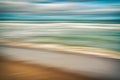 Abstract seascape. Idyllic tropical beach and beautiful cloudy sky. Blue, turquoise, and orange colors.