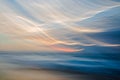 Abstract seascape. Motion blur tropical beach sunset with sun reflections.