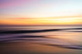 Abstract seascape, sunset on the beach, colorful scene in bright golden and purple colors Royalty Free Stock Photo