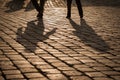 Shadows of people walking on an old street Royalty Free Stock Photo