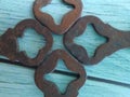 Abstract shape formed by old rusty keys, on a wooden table. Royalty Free Stock Photo