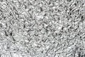 Abstract shiny crumpled silver metal chrome aluminum foil background texture