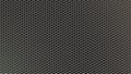 Abstract Shiny Hexagonal Metal Mesh in Dark Background