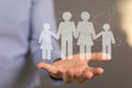 Abstract shot of male hands displaying 3D rendered family icons,children protection and care