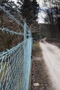 Abstract shot about a new metal fence near a byroad Royalty Free Stock Photo