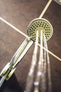 Abstract Shower head in bathroom with water drops flowing. Royalty Free Stock Photo