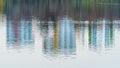 Abstract sight on lake, reflections of city buildings on water surface Royalty Free Stock Photo