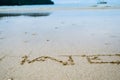 Abstract sign of word hate written on a sand beach background Royalty Free Stock Photo