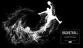 Abstract silhouette of a basketball player on dark black background. Basketball player jumping and performs slam dunk. Royalty Free Stock Photo