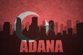 Abstract silhouette of the city with text Adana at the vintage turkish flag