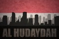 Abstract silhouette of the city with text Al Hudaydah at the vintage yemen flag Royalty Free Stock Photo