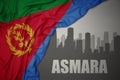 Abstract silhouette of the city with text Asmara near waving colorful national flag of eritrea on a gray background