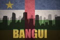 Abstract silhouette of the city with text Bangui at the vintage central african republic flag Royalty Free Stock Photo