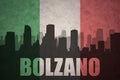 Abstract silhouette of the city with text Bolzano at the vintage italian flag