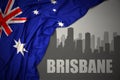 Abstract silhouette of the city with text Brisbane near waving national flag of australia on a gray background