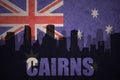 Abstract silhouette of the city with text Cairns at the vintage australian flag