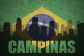 Abstract silhouette of the city with text Campinas at the vintage brazilian flag